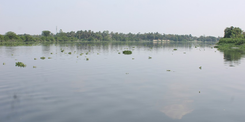 A glimpse of the Seetha Devi Lake featuring shimmering blue waters and greenery.