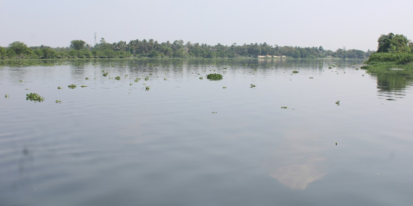 A glimpse of the Seetha Devi Lake featuring shimmering blue waters and greenery.