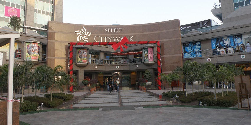 A frontal view of the majestic entrance of a premier shopping mall in Delhi