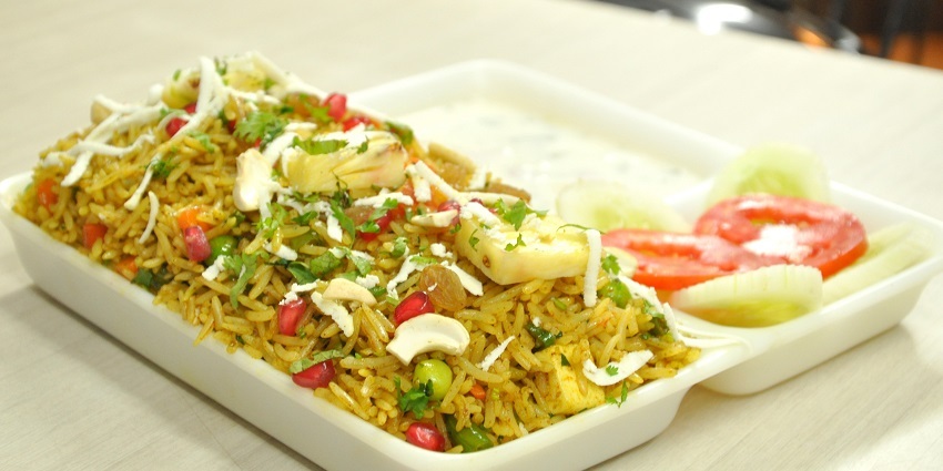 Gorge on fragrant Kashmiri Pulao with dry fruits and nuts at the Shamyana Restaurant.