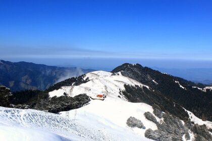 panoramic image of the beautiful Shikari Devi Wildlife Sanctuary covered in snow