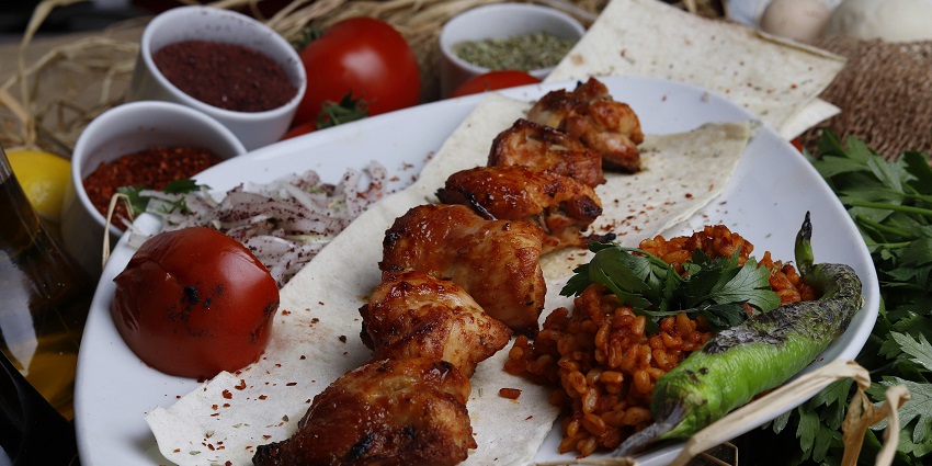 Shish Tawook, marinated chicken skewers grilled to perfection, is a must-try dish.