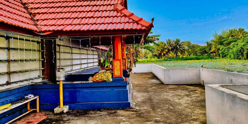 View of Polpully Shiva temple in Palghat district in Kerala with trees in background.