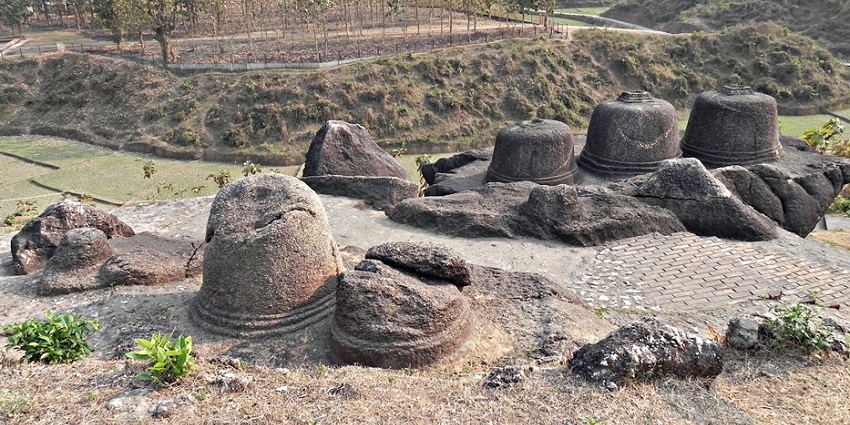Surya Pahar with ancient Sivalings and stupas, showcasing historical and spiritual heritage.