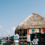 A mesmerising view of a shop with different colourful clothes and accessories displayed.