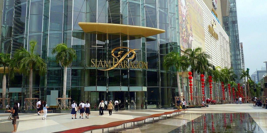 Siam Paragon shopping mall in Bangkok with its modern architecture and bustling entrance.