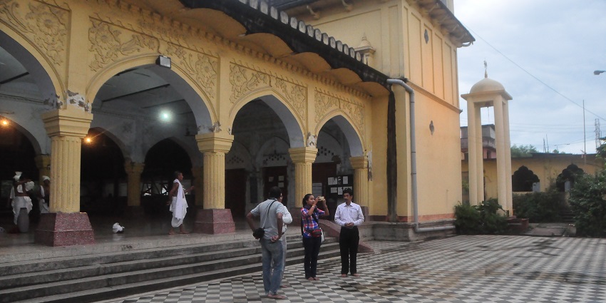 Shree Govindajee Temple, a majestic facade, golden domes, and intricate architecture.