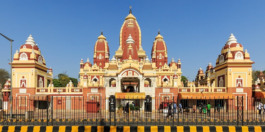 A picture of a temple in South Delhi taken from across the street having intricate designs