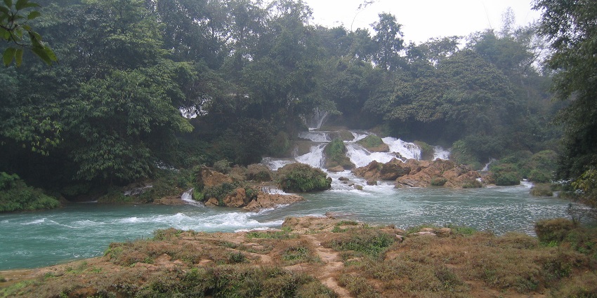 Enjoy the scenic surroundings and lush green landscapes of Silver Waterfall (Thac Bac).