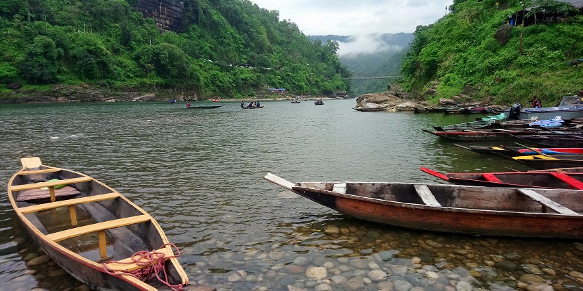 Witness the mesmerising views while boating on the Simsang River in Meghalaya, India.
