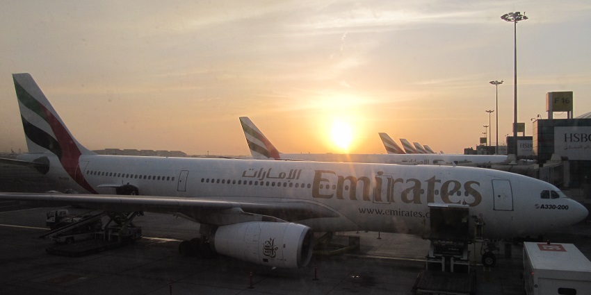 The view of the sun rising at the line of Emirates model at the Sir Bani Yas Airport, UAE.