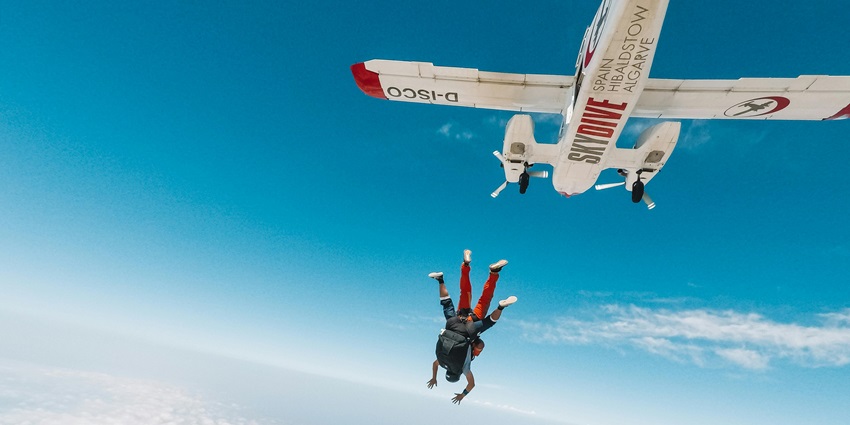 Scenic snapshot of a skydiver freefalling from a certain height–Skydiving Singapore