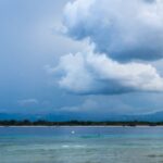 A picture taken from the Gili Islands showing the vast sea and huge clouds