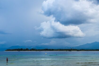 A picture taken from the Gili Islands showing the vast sea and huge clouds