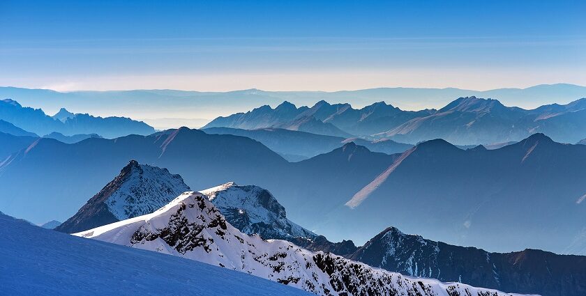 A breathtaking landscape of snow-covered mountains during the daytime in Switzerland.