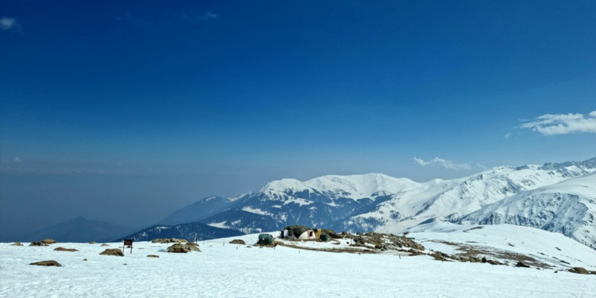 snow covered mountain with a house on top of it - Ningle Nallah is one of the best places for camping