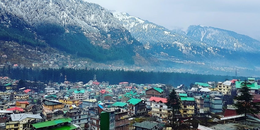 Panoramic image of a snow laden city of Manali during the winters of Himachal