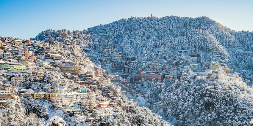 Panaromic enchanting image of a hilly town covered in the snow near Kibber wildlife sanctuary