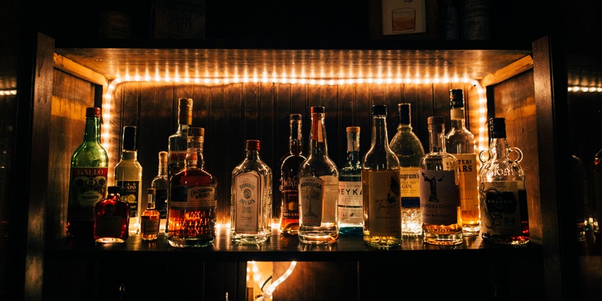 Alcohol bottles placed on a restaurant counter