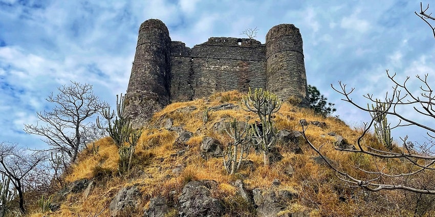 A scenic glimpse of the iconic Banasar Castle surrounded by nature’s allure in Solan.