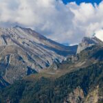 A stunning view of Sonmarg in Kashmir with mountains in the background during the day.