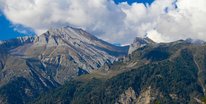 A stunning view of Sonmarg in Kashmir with mountains in the background during the day.