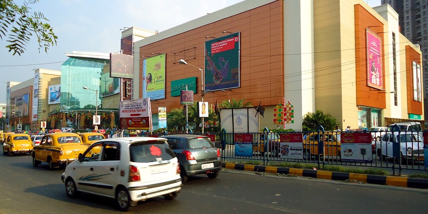 A view of the South City Mall in Kolkata during the daytime in front a busy road.