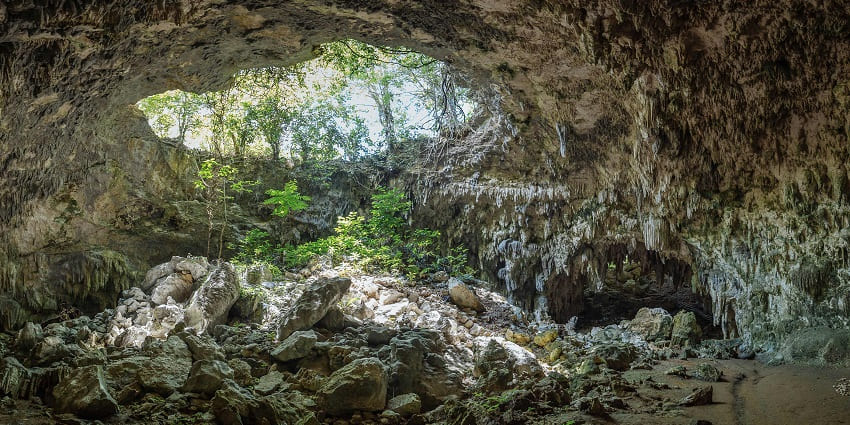 Image of a rock cave around the jungle - similar to the Split Rock in Mawsynram, Meghalaya