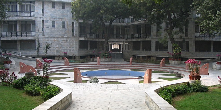 A temple in South Delhi with gardens and a walkway in the complex along with traditional architecture
