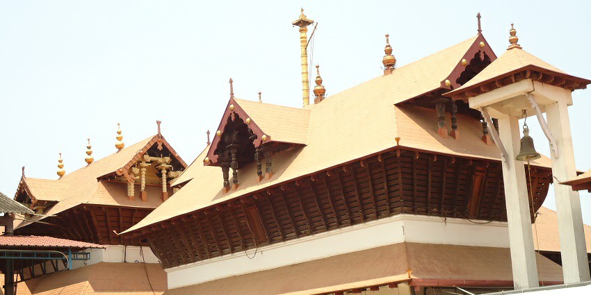 A picture of a temple with traditional Kerala architecture