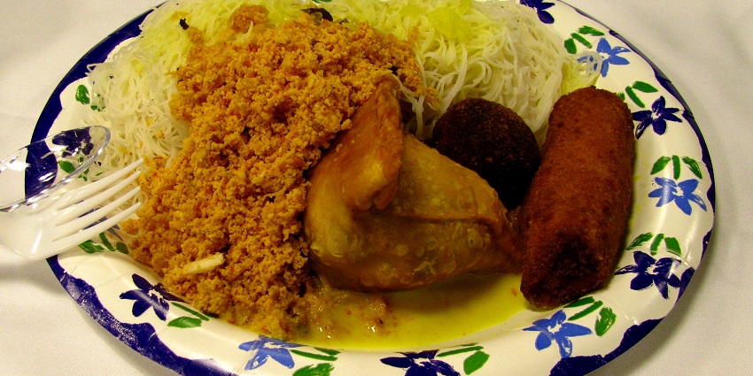 Vibrant spread of Sri Lankan dishes featuring rice, curry, and fresh vegetables.