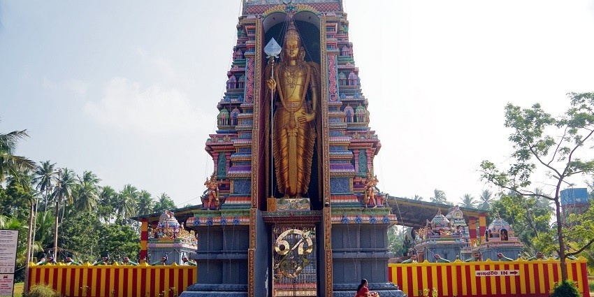 A picturesque view of Munneswaram Temple with detailed carvings and a serene natural backdrop.