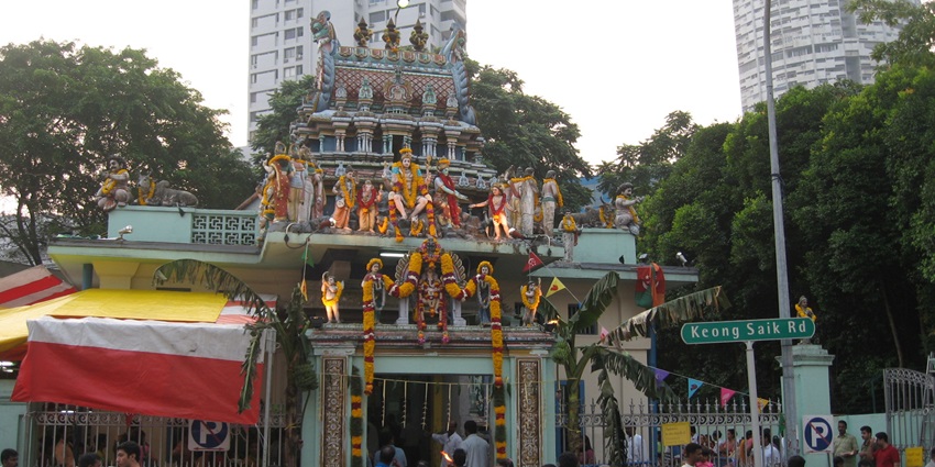 People worshipping at a temple during day time