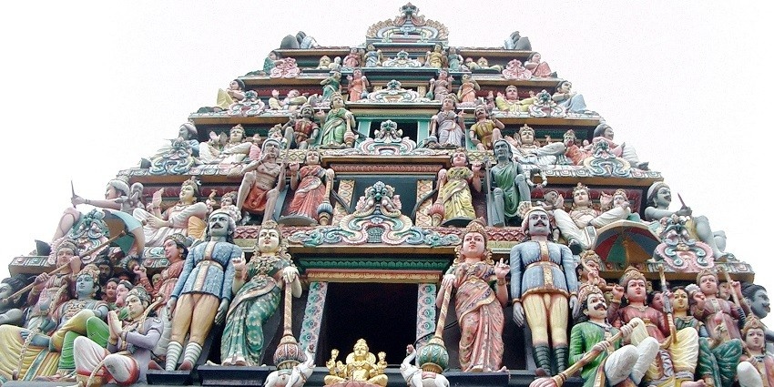 A picture of a Hindu temple in Singapore with gopurams over the entrance gate