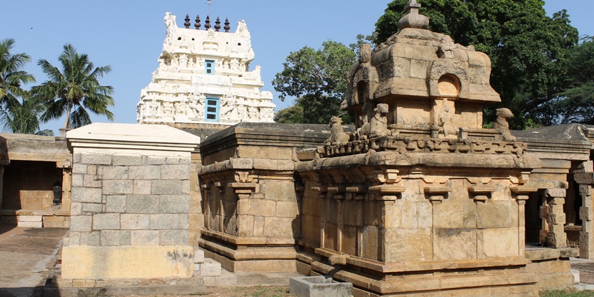 A picture of a historical Shiva temple in Palakkad with intricate wall carvings all around