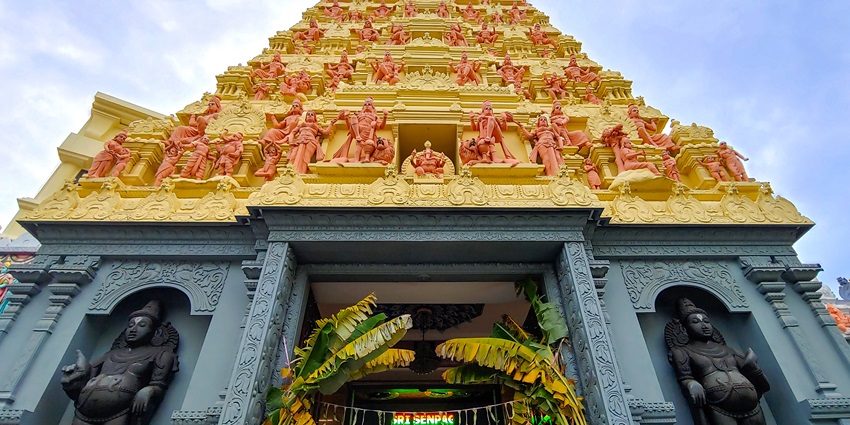 A temple in Singapore with a golden roof