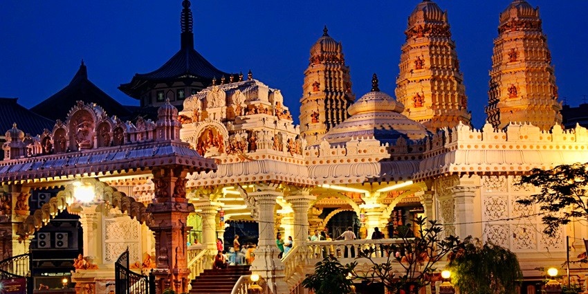 People worshipping at the Sri Sivan Temple during night time