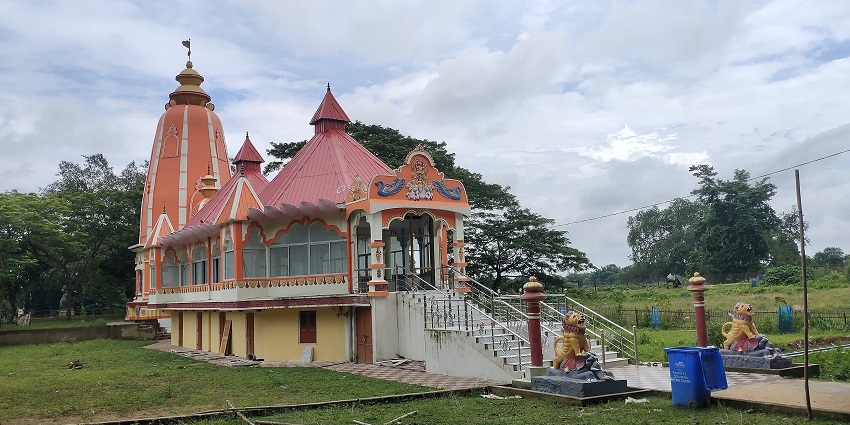 Sri Surya Pahar Temple with ancient rock carvings and scenic surroundings in Assam.