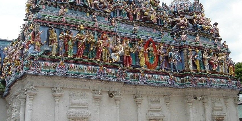 A Hindu temple in Singapore with detailed carvings of Hindu deities on outer walls