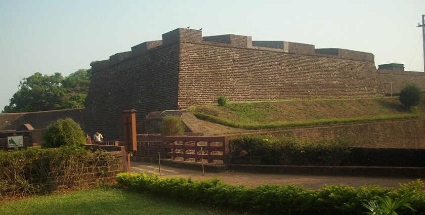 A picture of the St. Angelo Fort taken from a distance with the nearby gardens visible along with the walkway