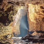 Scenic image of the entrance of the beautiful Mawsmai Cave amidst the dense forest