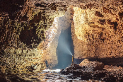 Scenic image of the entrance of the beautiful Mawsmai Cave amidst the dense forest