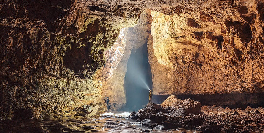 Scenic image of the entrance of the beautiful Mawsmai Cave amidst the dense forest