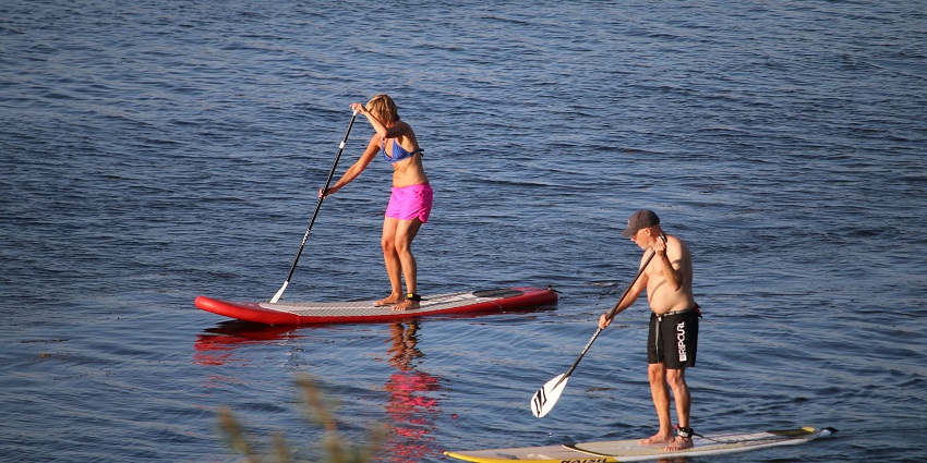 You can try stand-up paddle boarding by gliding and balancing across the crystal-clear water.