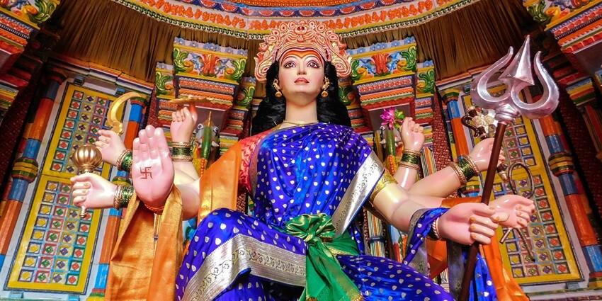 Hindu goddess adorned with traditional jewellery and garments, displaying divine grace.