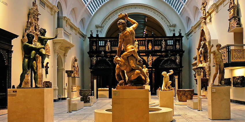 An inside view of the famous Sualkuchi Silk Museum, featuring statues and figurines.