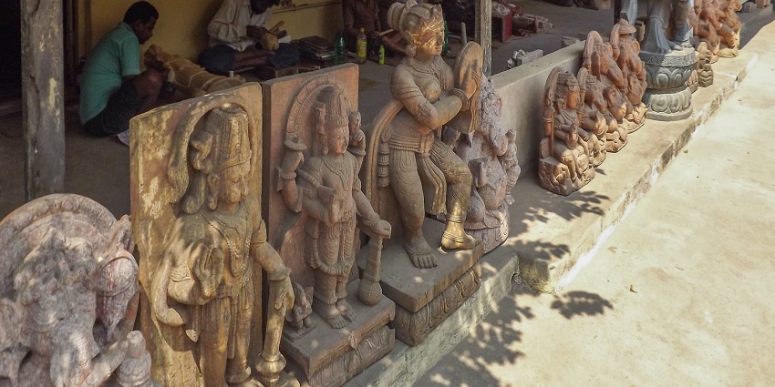 Artisans working at Sudarshan Craft Museum, an artistic gem near Sudam Sand Art Museum.