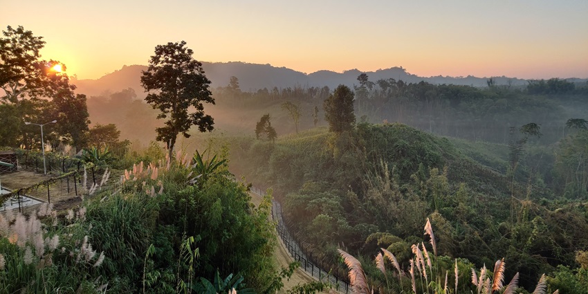 Image of a beautiful sunrise in Tripura, seen across from the jungle and National Park