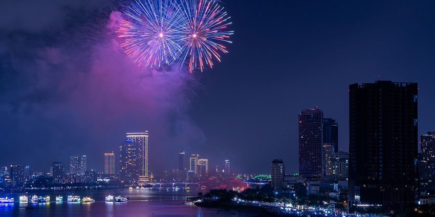 Fireworks display above Hanoi at night, lighting up the sky