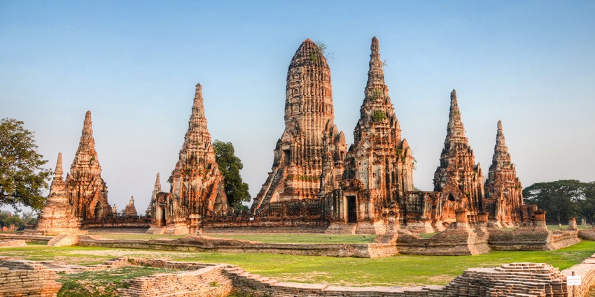 Sunset at Wat Chaiwatthanaram, casting a warm glow over the ancient temple ruins.